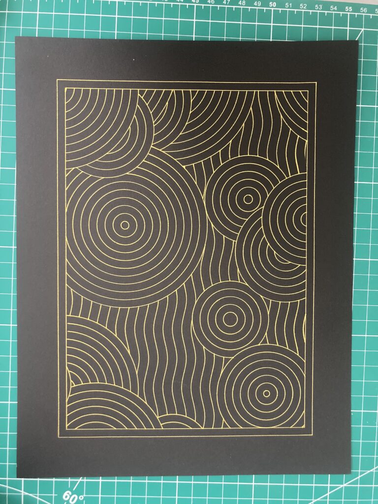 A geometric pattern made of circles and squiggly lines printed in gold on black paper