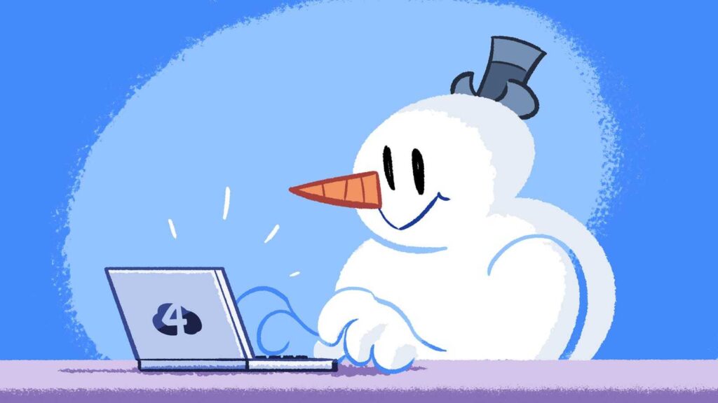 A snowman web developer works on a laptop with the Cloud Four logo on the back of it. Code freeze for the holidays. Get it?