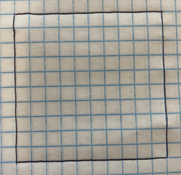 A square drawn on graph paper